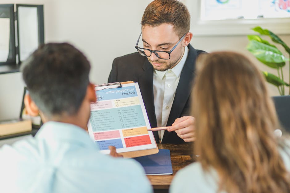 A person seated at a wooden table holding a clipboard with a home inspection checklist titled 'For Buyers,' which is partially visible. The checklist is divided into sections with different colours: b